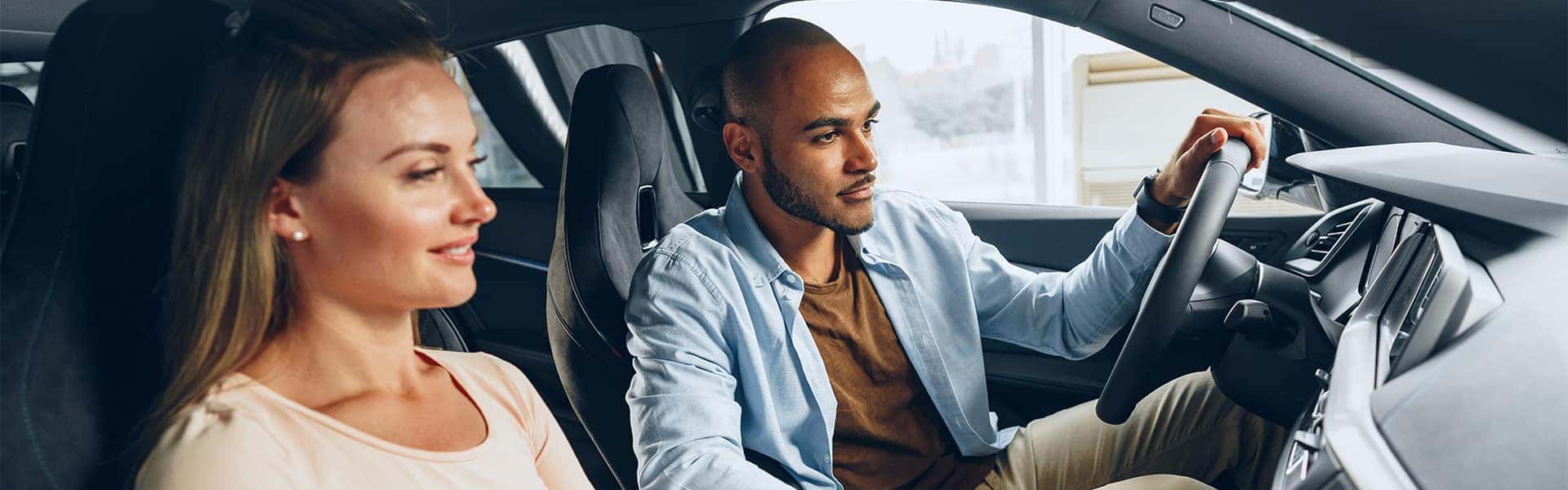 Trading in/selling your vehicle with Bennett Maserati of Allentown | Couple Test Driving a Vehicle
