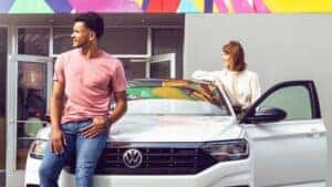 A Couple Happy With Their New Volkswagen