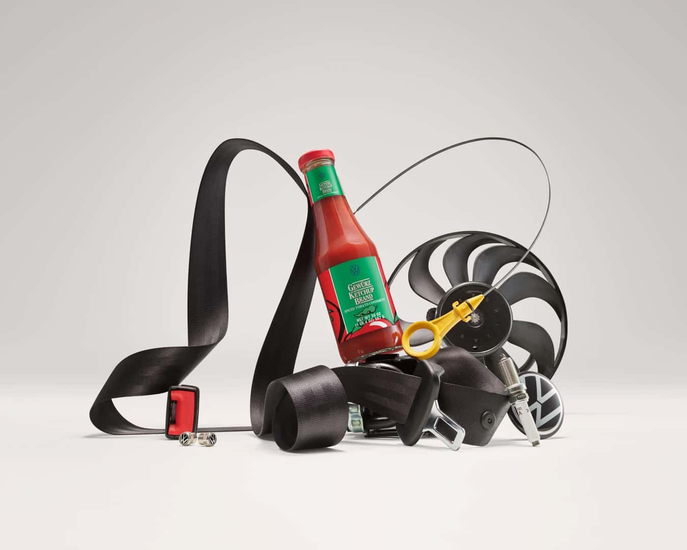 The Delicious Ketchup Bottle Posed With A Seatbelt And Other Car Parts
