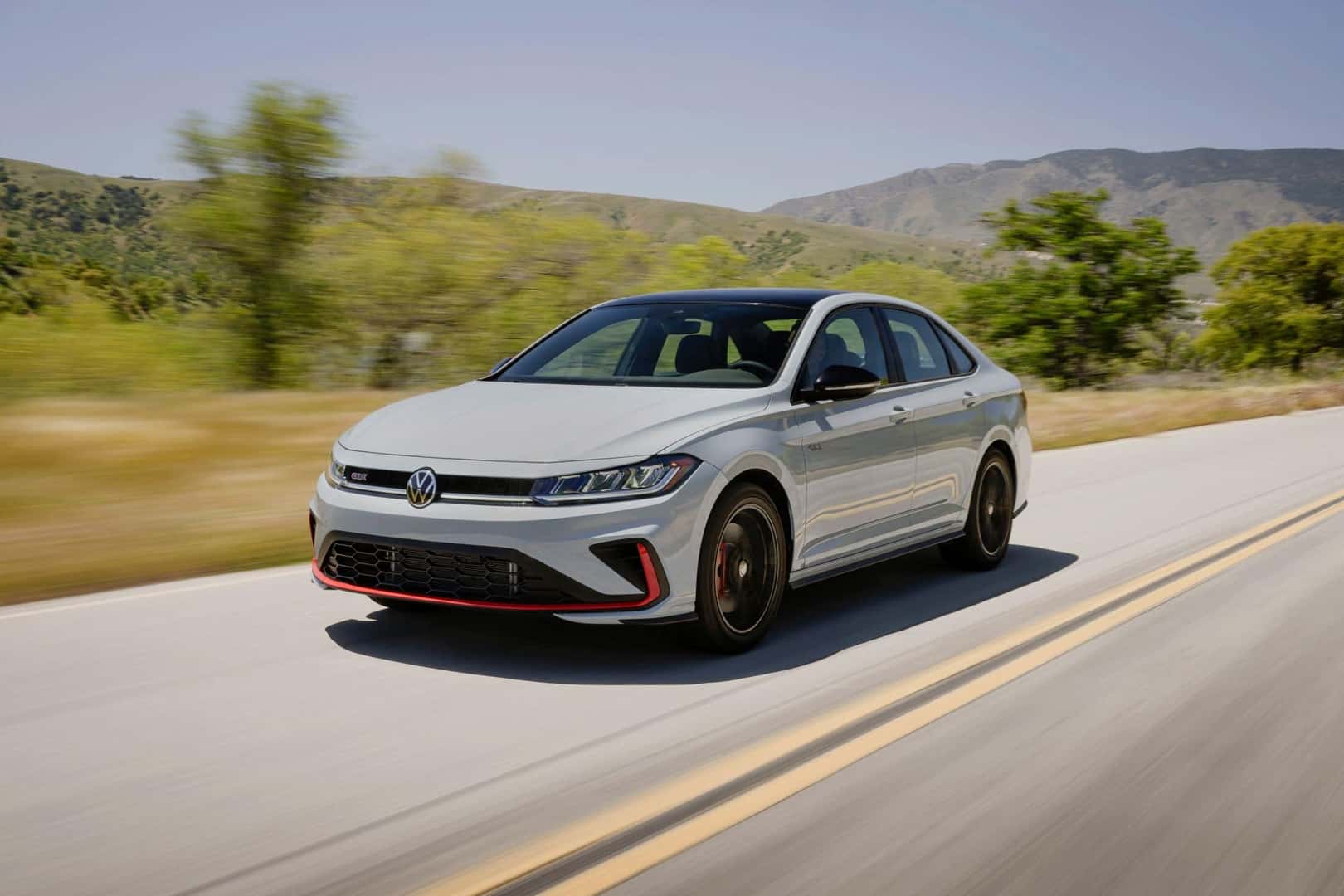The Majestic 2025 Volkswagen Jetta GLI, Driving Past The Country