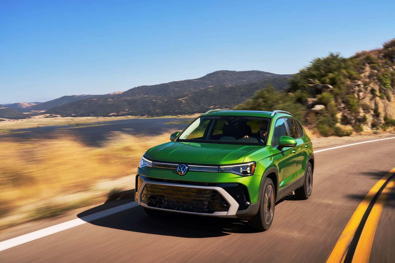 The New And Improved 2025 VW Taos, Driving Past Golden Grass