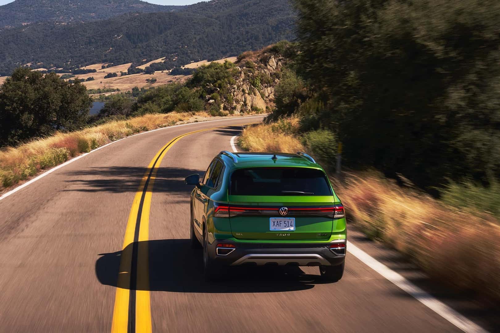 2025 Volkswagen Taos Bright Moss Green driving