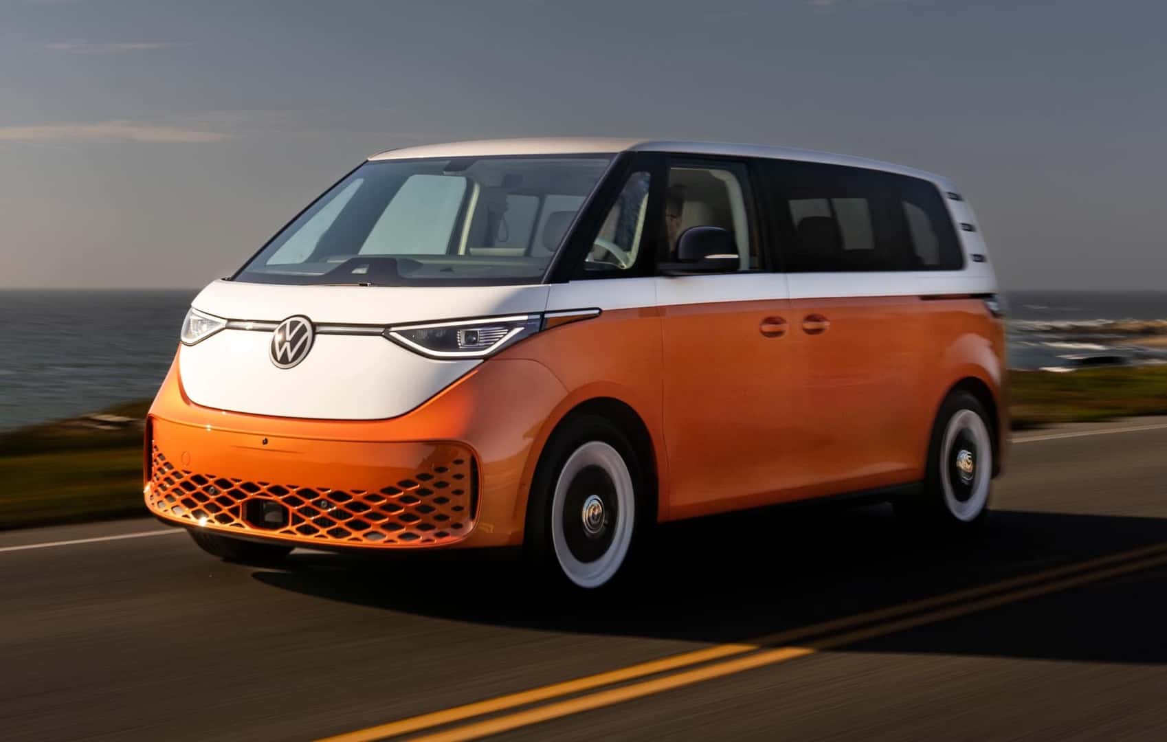 2025 Volkswagen ID.Buzz Candy White over Energetic Orange front and driver side view