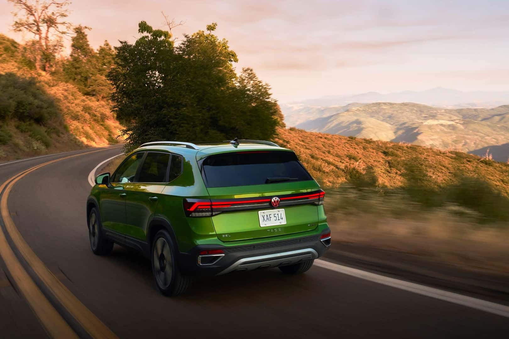 The Fantastic And Cost-Efficient Volkswagen Taos Cruising Along A Hillside Road