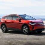 The Sexy Red Exterior Of The 2024 Volkswagen ID.4, Charging On The Concrete