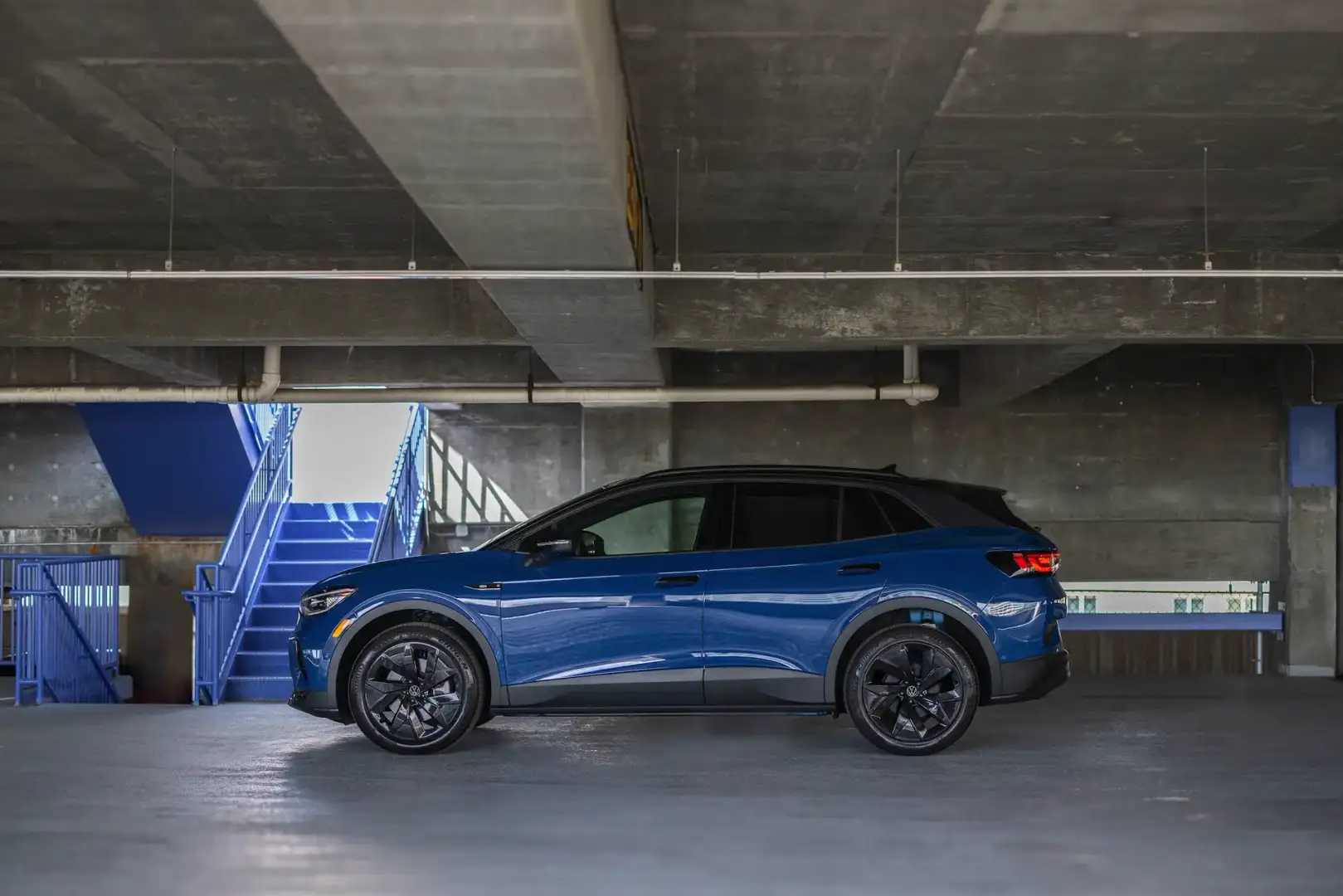 2025 blue ID.4 side view in parking garage