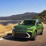 2025 Volkswagen Taos Bright Moss Green Metallic in motion