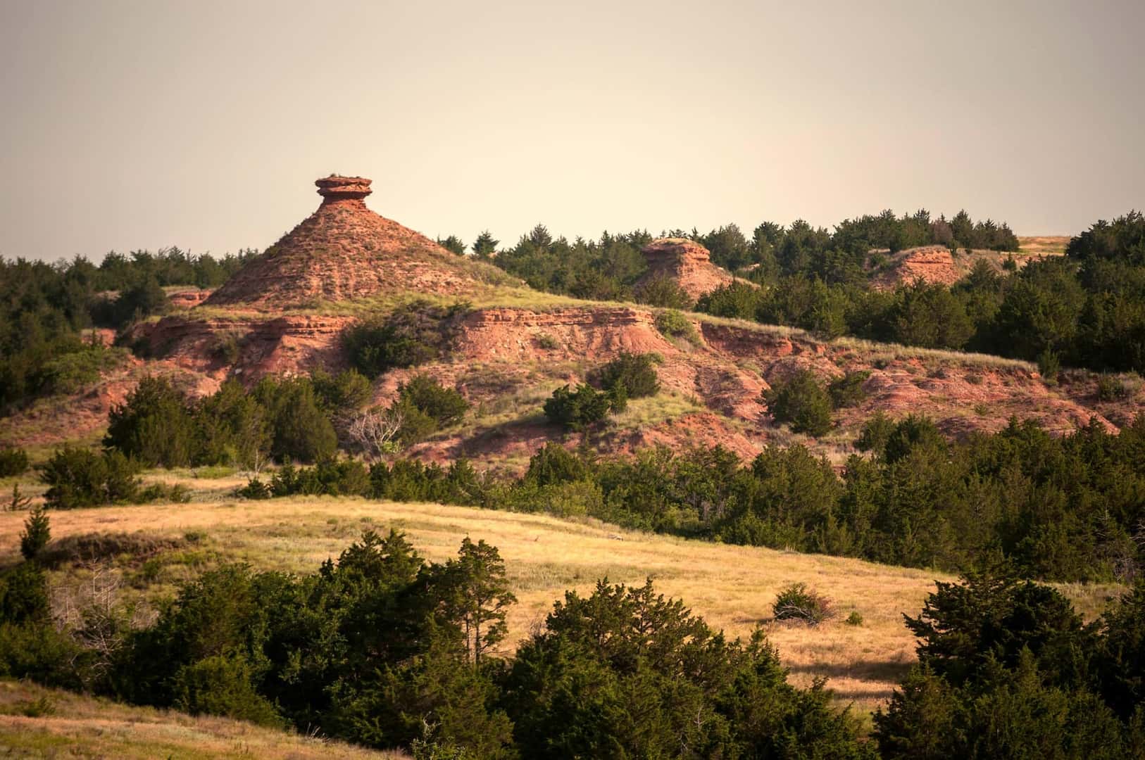 The Craggy Canyons, Punctuated By Red Buttes Rising From The Rolling Red Hills Of Gypsum Hills