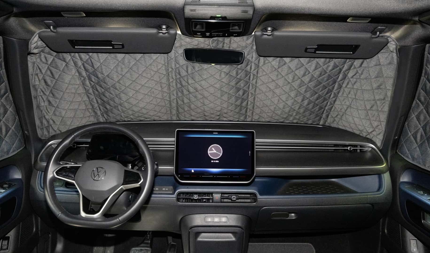 The Sleek And Futuristic Front Interior Of The Volkswagen Atlas, Which Has A Window Covered By A Insulated Blanket