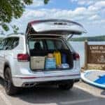 2026 Volkswagen Atlas rear liftgate open with packed beach gear at Lake Olathe Park in Olathe, KS