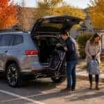2026 Volkswagen Atlas with open liftgate at a Johnson County parking area on a fall afternoon