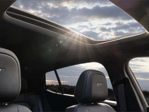 2024 Buick Envista interior view with the moonroof open allowing sunlight in