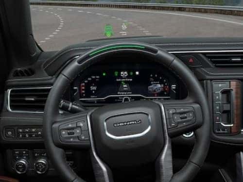 2024 GMC Yukon view of heads up display showing speed and super cruise displayed on driver dash 