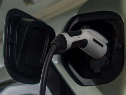 2024 Hummer EV SUV close up view of vehicle getting charged