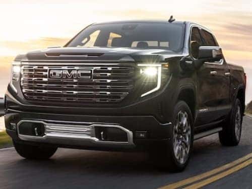 2024 GMC Sierra 1500 Denali driving on a blacktop