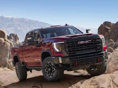 2024 GMC Sierra HD AT4 parked on a rocky mountain top