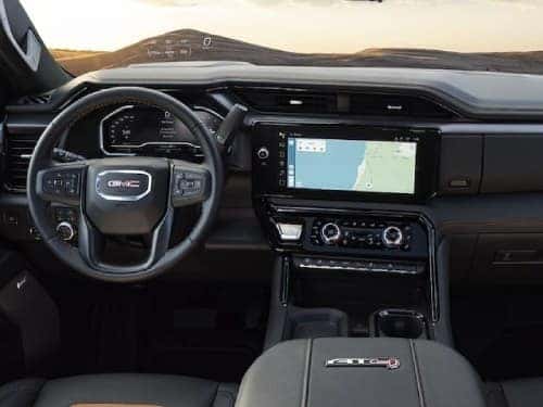 2024 GMC HD AT4 interior view of front seating area and dash