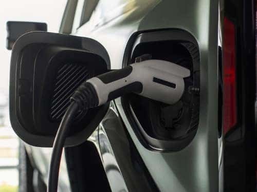 2025 GMC Hummer EV SUV close up view of charging