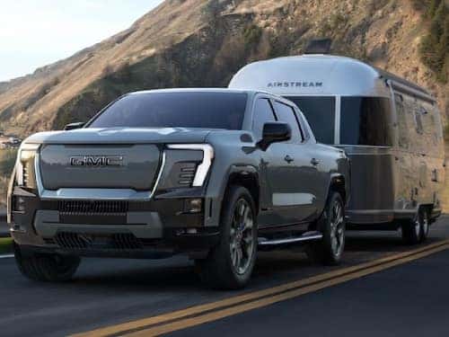 2025 GMC Sierra EV Denali towing an airstream