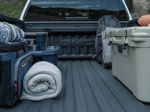 2025 GMC Canyon bed of truck with camping supplies