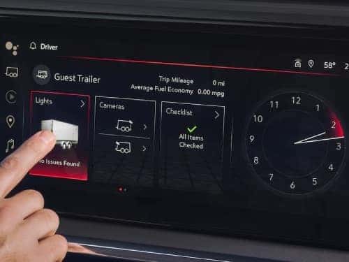 2025 GMC Sierra 1500 AT4 trailering app shown on touchscreen