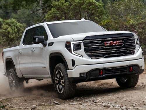 2025 GMC Sierra 1500 AT4 offroading on a rocky path