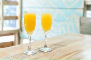 Sunday brunch with two glasses of mimosas on a table