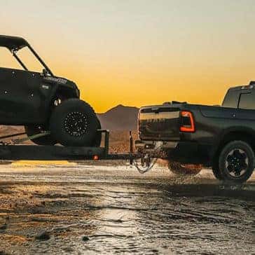 Ram 1500 Pulling a side by side on a trailer
