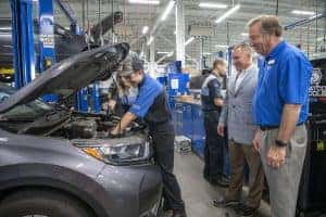 Ed Voyles GMs watch Automotive Interns work at Chattahoochee Tech in Georgia
