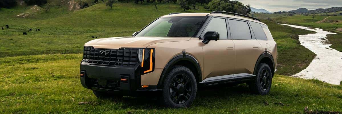 2027 Kia Telluride 3-Row SUV Parked in a Field