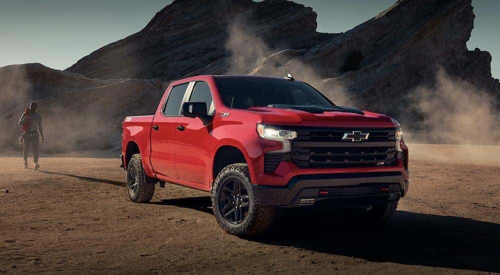A red 2023 Chevy Silverado 1500 Z71 is shown parked after leaving a Chevy truck dealer near Brighton AL.