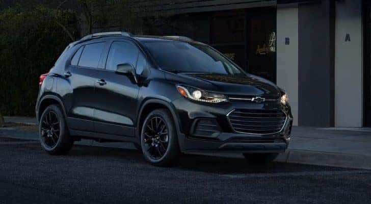 A black 2022 Chevy Trax is shown from the side.