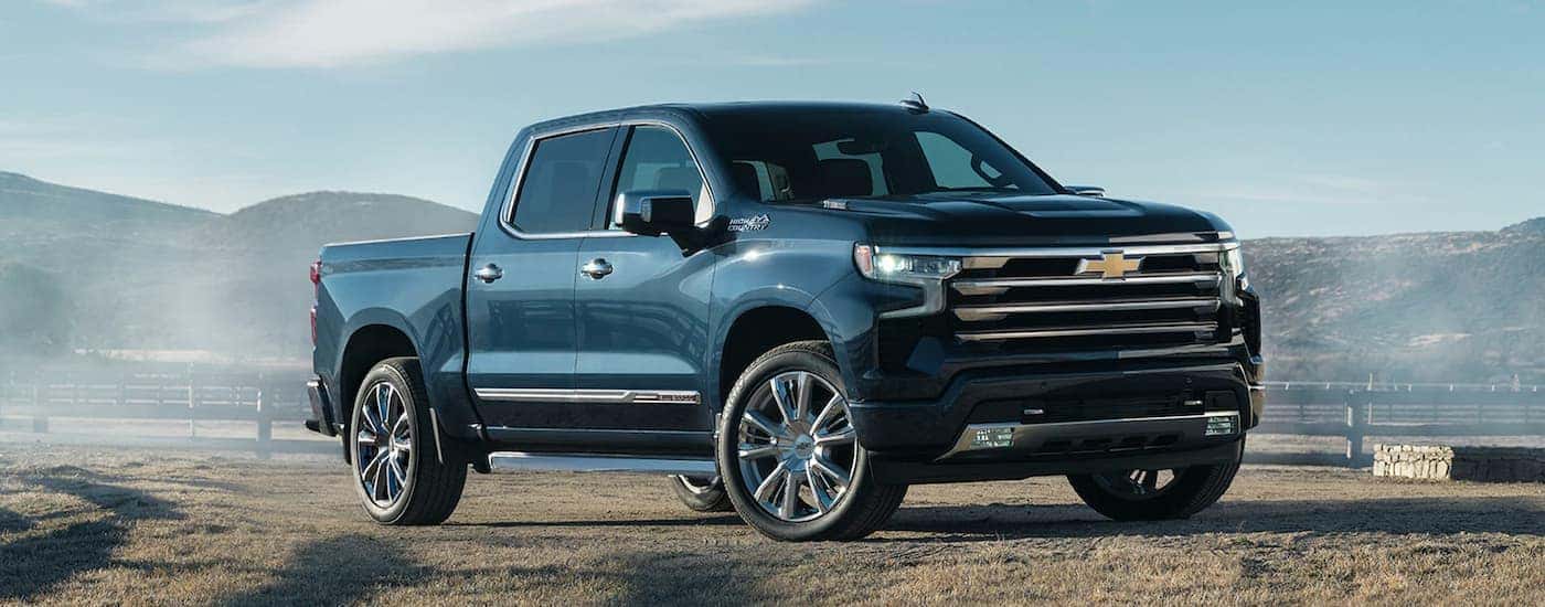 A blue 2022 Chevy Silverado 1500 High Country is shown after leaving a Chevy Silverado dealer.