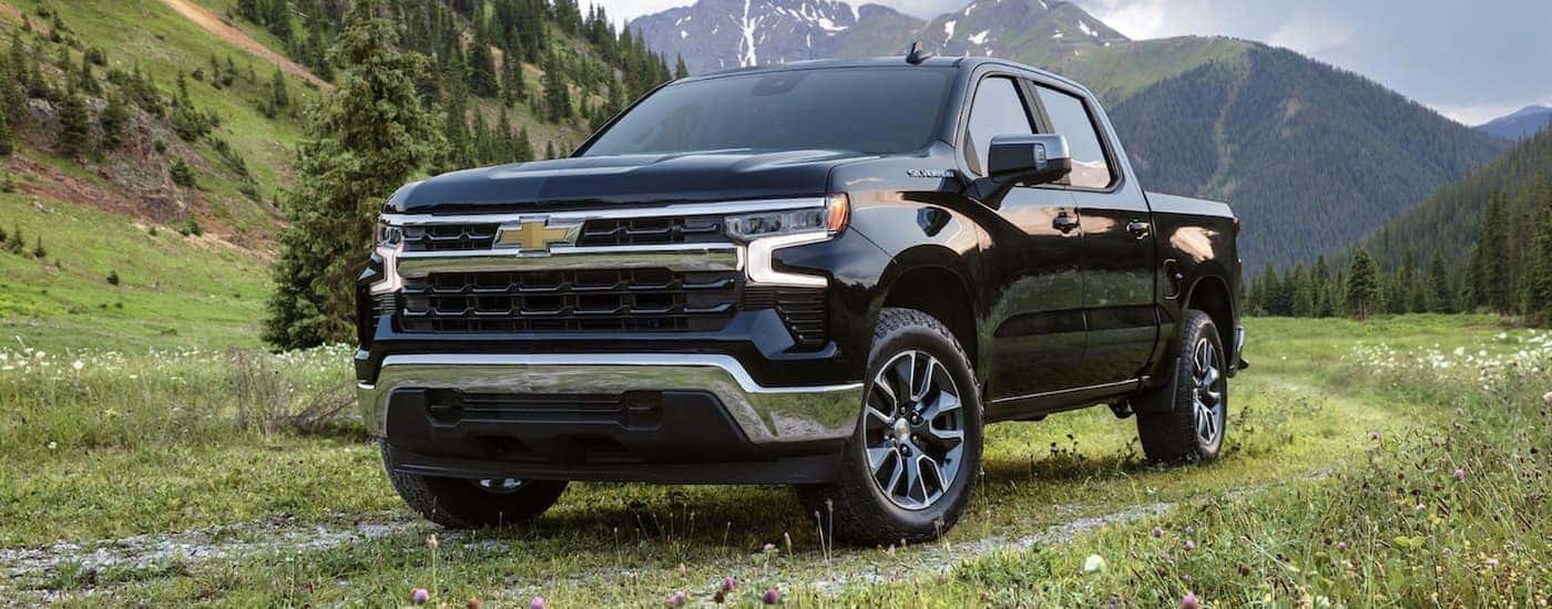 A popular Chevy Silverado for Sale Near Mountain Brook, AL, a black 2022 Chevy Silverado 1500, is shown from the front.