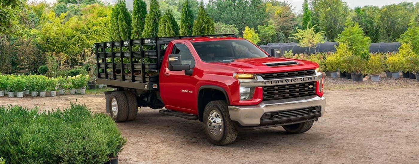 A red 2021 Chevy Silverado 3500 HD is shown from the front at an angle.