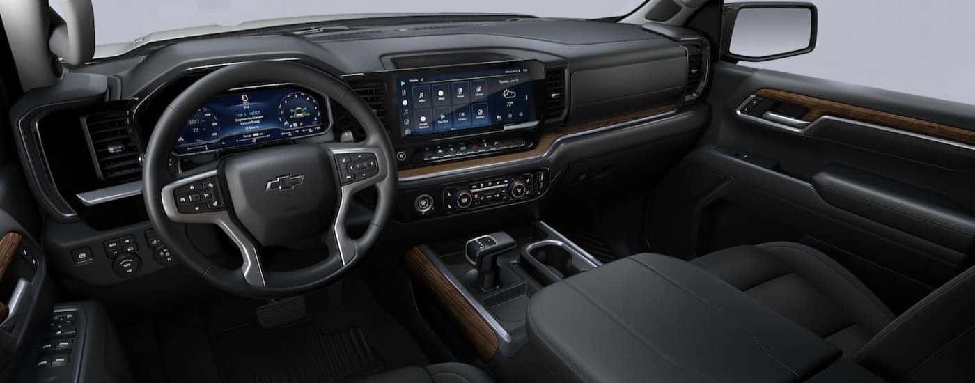 The black interior and dash of a 2023 Chevy Silverado 1500 RST is shown.