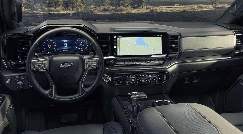 The black leather interior of a 2024 Chevy Silverado 1500 High Country.