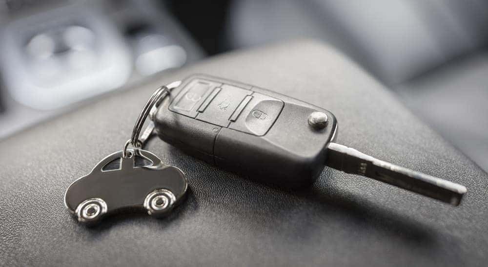A close-up of a car key is shown.