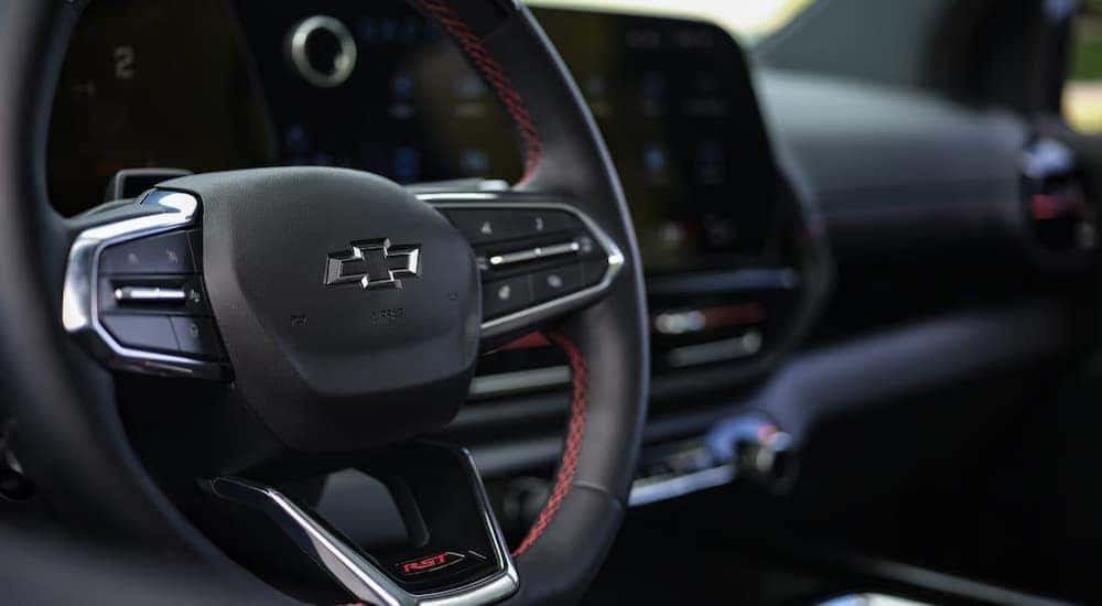 A close up of the steering wheel in a 2024 Chevy Silverado EV.