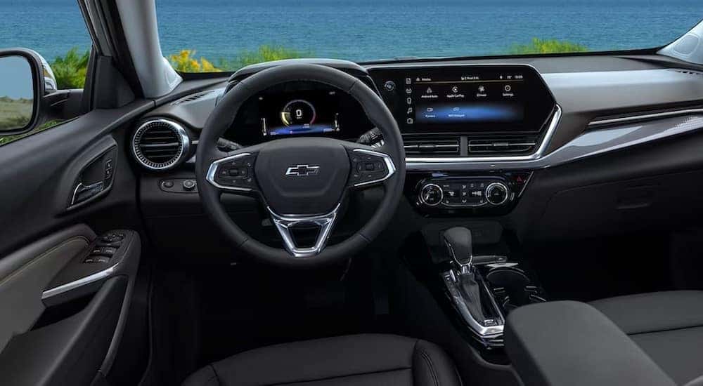 The black interior and dash in a 2024 Chevy Trax is shown.