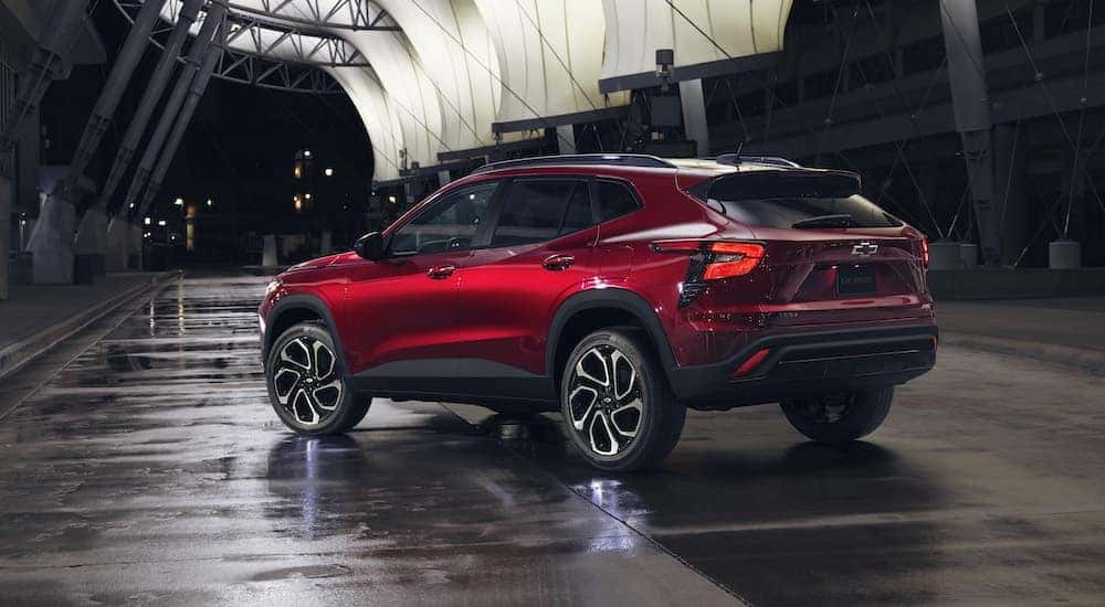 A red 2024 Chevy Trax RS is shown from the rear at an angle.