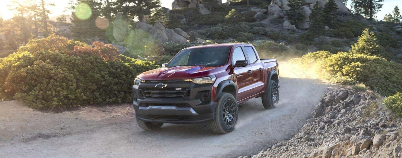 A red 2024 Chevy Colorado Trail Boss is shown from the front at an angle.
