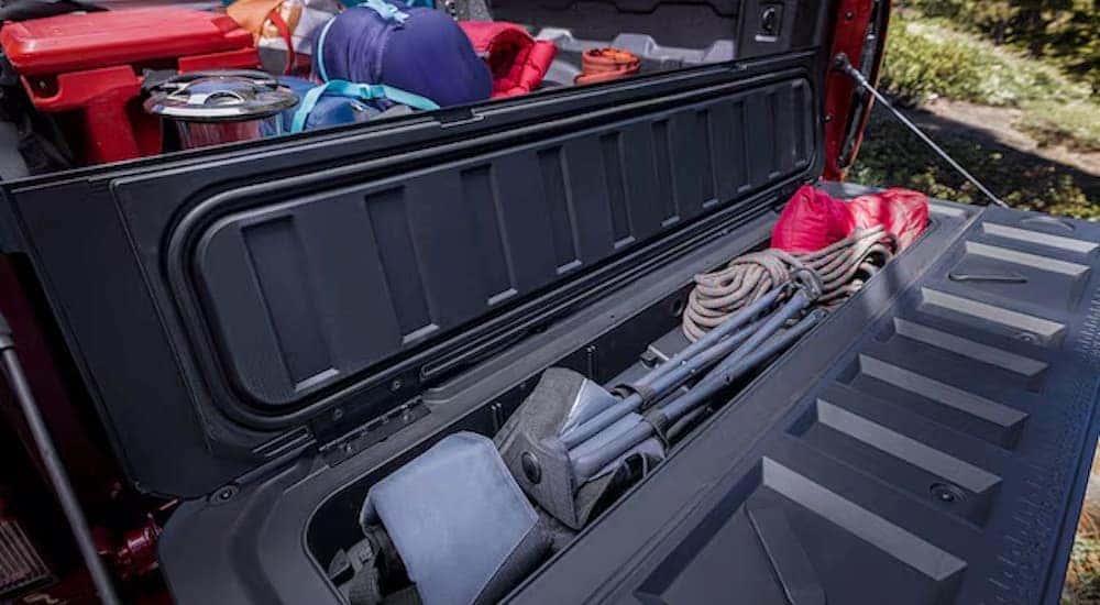The StowFlex tailgate on a red 2024 Chevy Colorado Trailboss is shown.