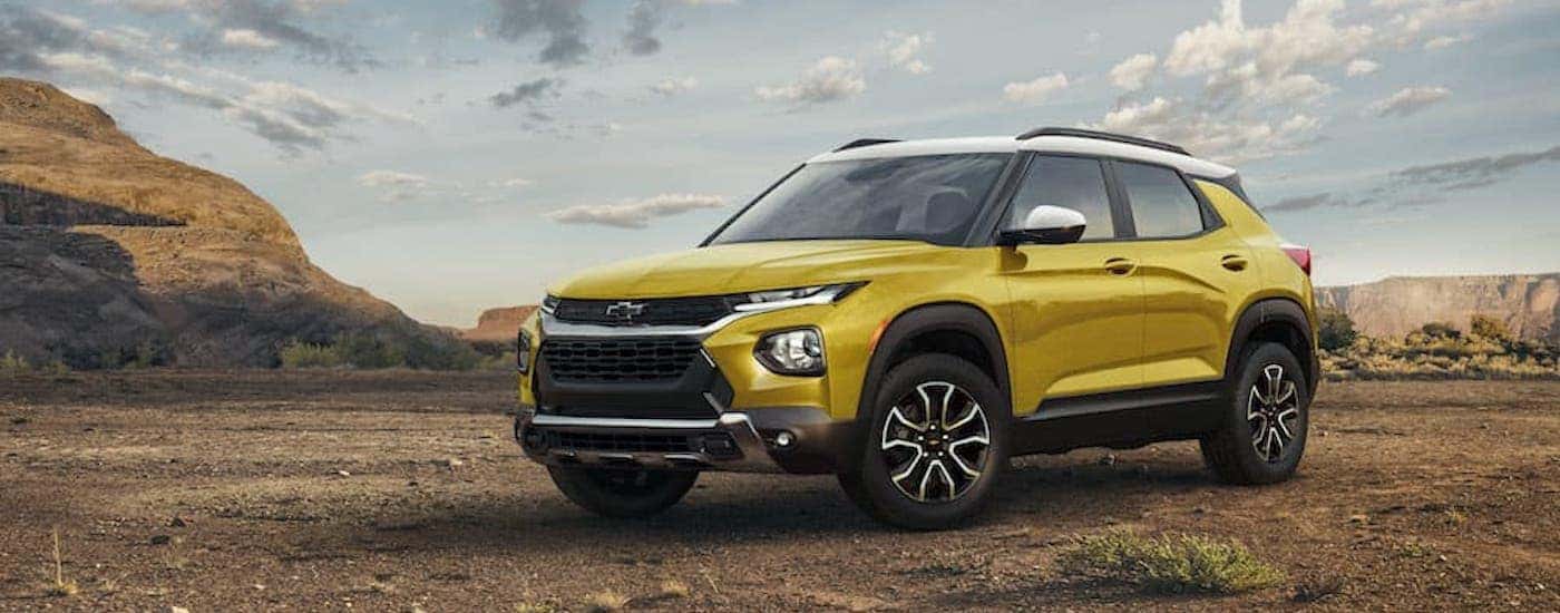 A yellow 2023 Chevy Trailblazer ACTIV is shown from the front at an angle.