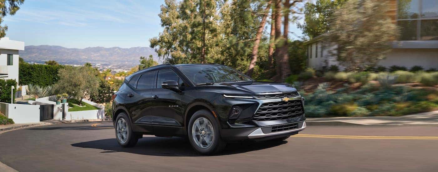 A grey 2024 Chevy Blazer is shown from the front at an angle.