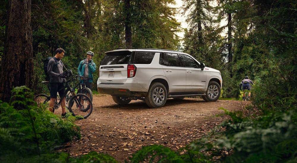 A white 2022 Chevy Tahoe Z71 is shown parked off-road.