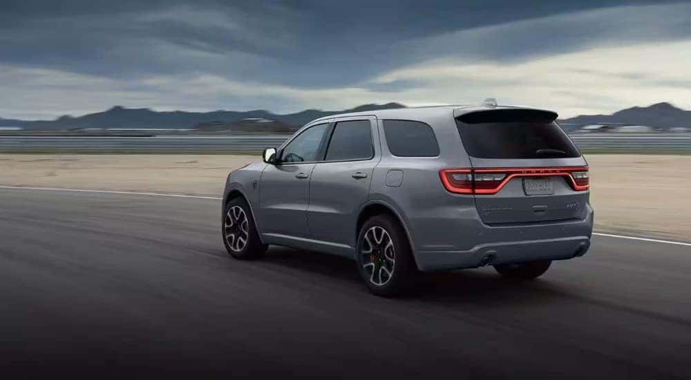 A gray 2022 Dodge Durango SRT is shown driving on a track.