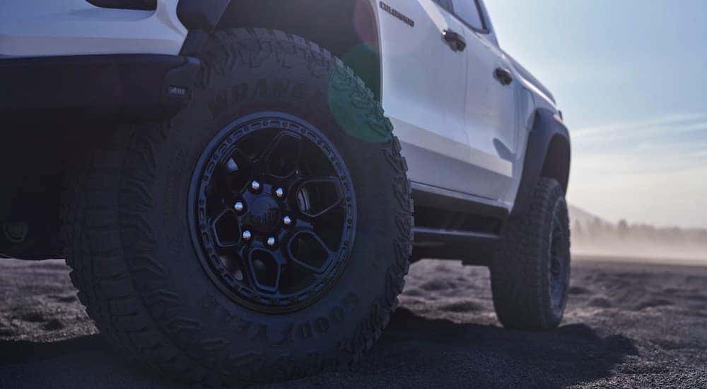 Low angle close-up on the wheels of a white 2024 Chevy Colorado ZR2 Bison.