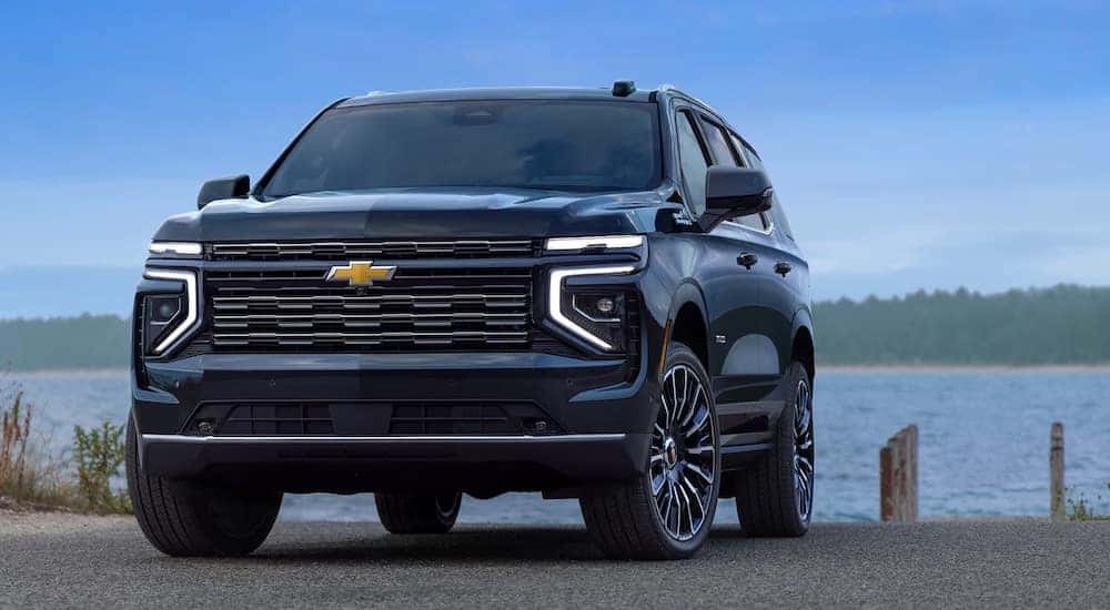 A black 2025 Chevy Tahoe for sale is shown from the front at an angle.