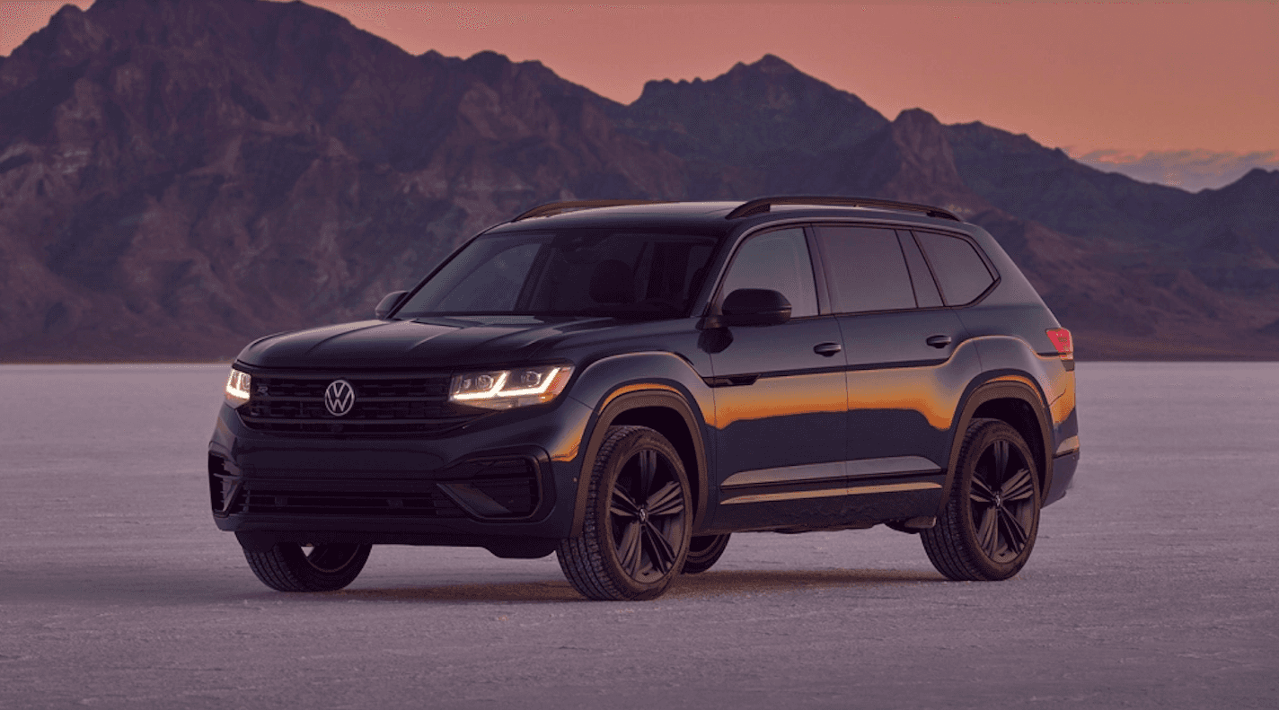 2022 Volkswagen Atlas parked on a road near mountains. 